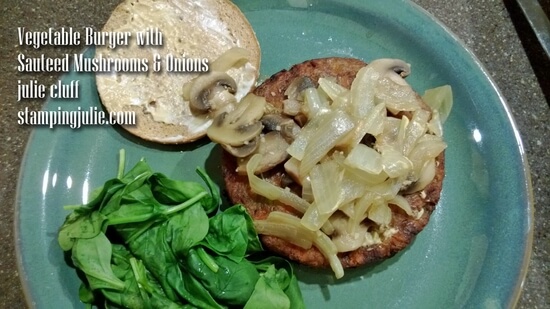 veggie burger with sauteed mushrooms and onions with steamed spinach